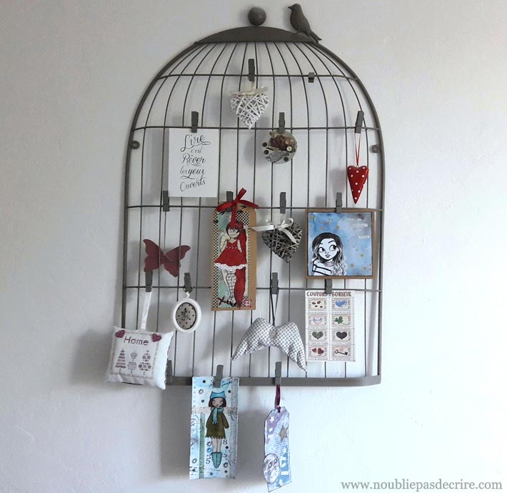 Un mood bord cage à oiseaux pour ses cartes postales